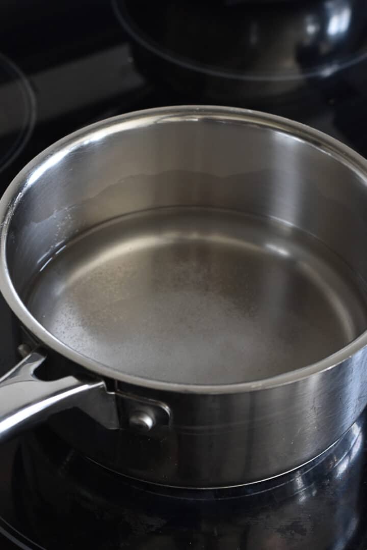 boiling water with pinch of salt.