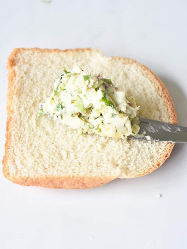 fresh herby garlic butter on the bread