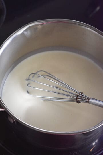 transfer cream into saucepan.
